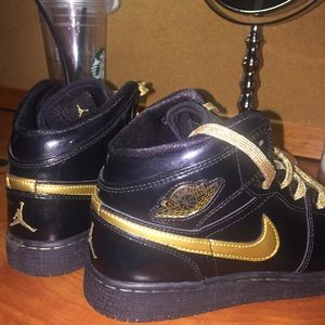 Black & gold Nike Air Jordan 1's
