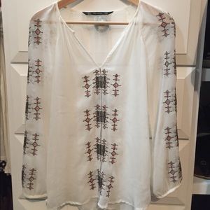 White flowy three-quarter sleeved shirt