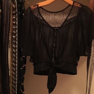 See through top with butterfly sleeves.