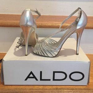 Also Silver metallic stilettos