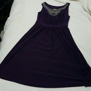 Purple dress with silver neck line embroidery.