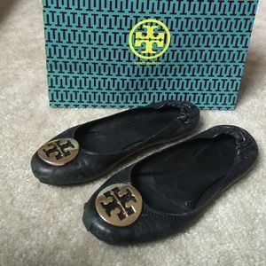 Black Reva classic pumps with Tory B gold buckle