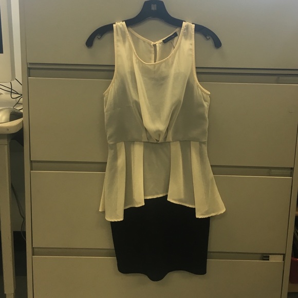 Black and cream colored chiffon peplum dress