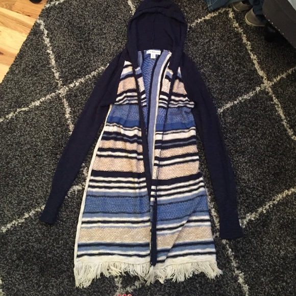 Knee length cardigan.