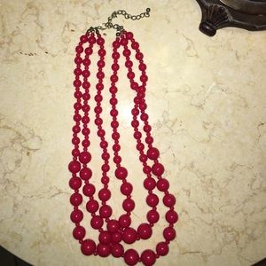 Red plastic bead necklace