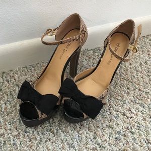 Diva Lounge snakeskin print heels with bows