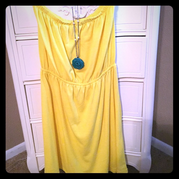 Strapless dress and necklace.