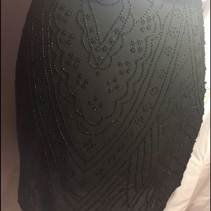 An adorable beaded short black skirt!