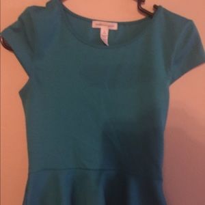 No brand cute top flares at the bottom worn once