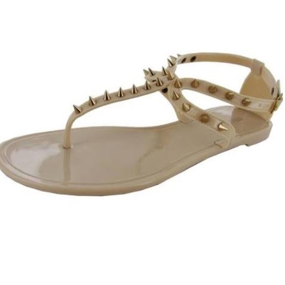 Spiked Steve Madden jelly shoes.