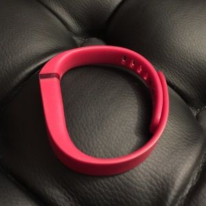Fitbit flex in red.