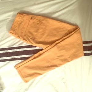 Melon colored skinny jeans