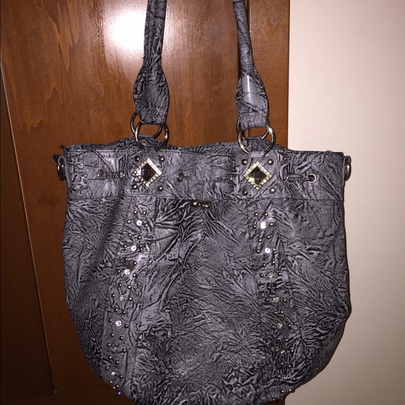Medium sized grey sparkly bag.