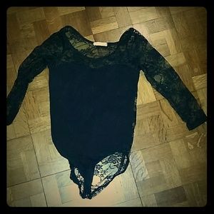 Adorable black leotard with floral pattern