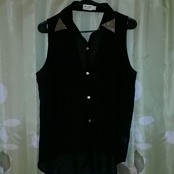 See thru black tank top with gold decals on collar