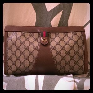 Gucci clutch with monogram print