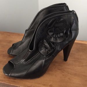 Black heel booties with cute flower detailing