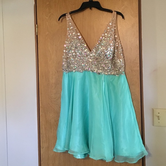 Gorgeous mint green prom dress with jewels.