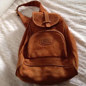 Gorgeous leather single strap cross body backpack.