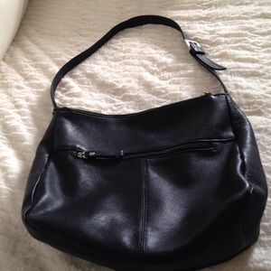 Multi zipped compartment leather bag.