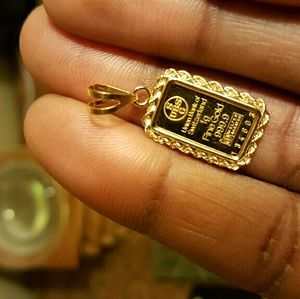 United Bank of Switzerland 1g dainty  pendant