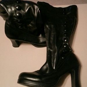Tall black boots with button details