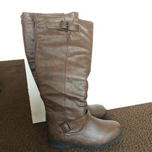 Brown faux leather boots.