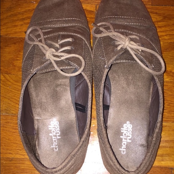 Brown faux leather loafers.