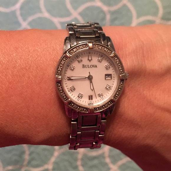 Women's Bulova watch w/ diamond studs.
