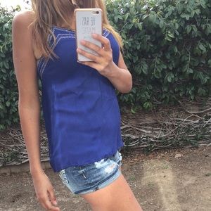 Cute blue tank with embroidery around the top