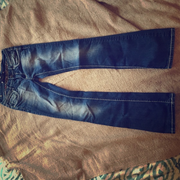 Medium wash, boot cut Vigoss jeans.