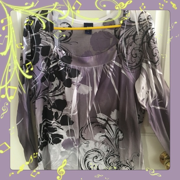 Light lavender, grey top with black designs.