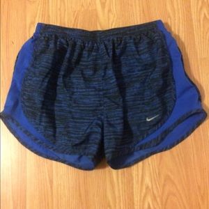Blue and black nike shorts.