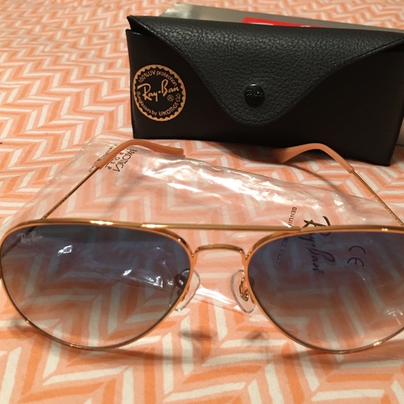 Ray Bans in blue tint with gold frame