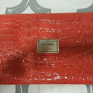 Orange clutch...Carried only twice.