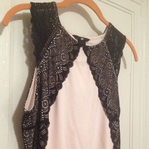 Sleeveless pink calf-length dress with black lace