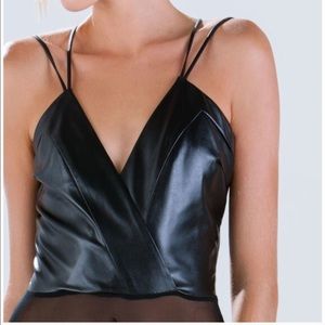 Faux leather bodysuit and asymmetrical skirt.