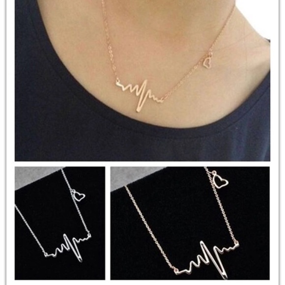 Silver tone heart beat necklace