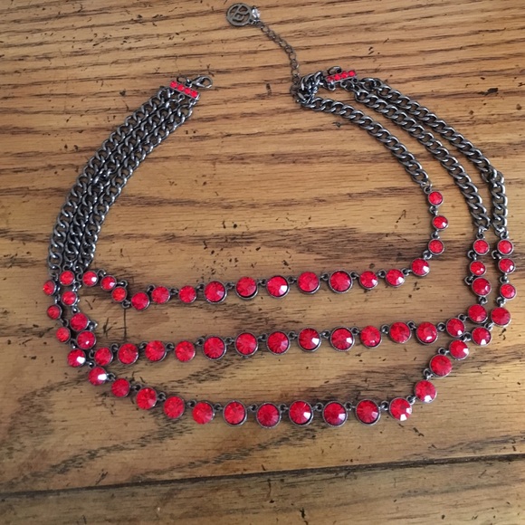 Red beaded necklace with black metal.