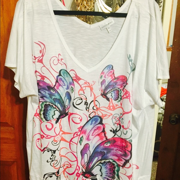 Pretty white tee with butterfly pattern.