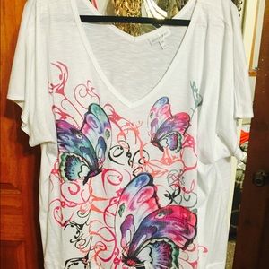 Pretty white tee with butterfly pattern.