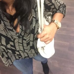 Off white leather Coach purse with brown stitching