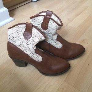 Brown and cream colored boots in great condition