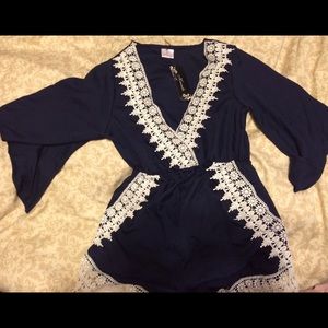 Navy and cream lace v neck romper