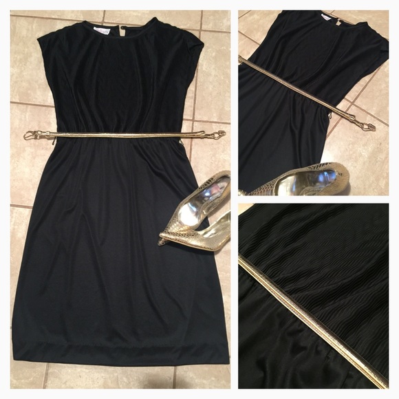 black dress below the knee.