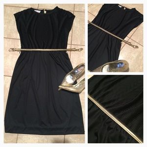 black dress below the knee.