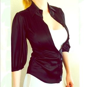 Bebe silk blouse . Still has tags xs