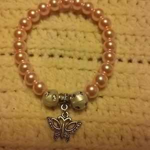 Stunning pink bead bracelet with butterfly charm