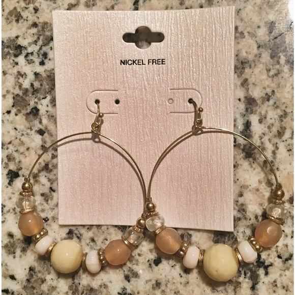 Beaded hoop dangling earrings.