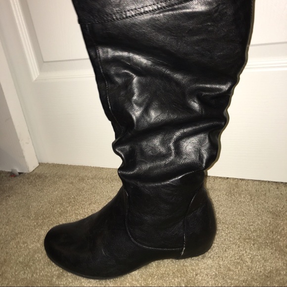 Over the knee black leather boots